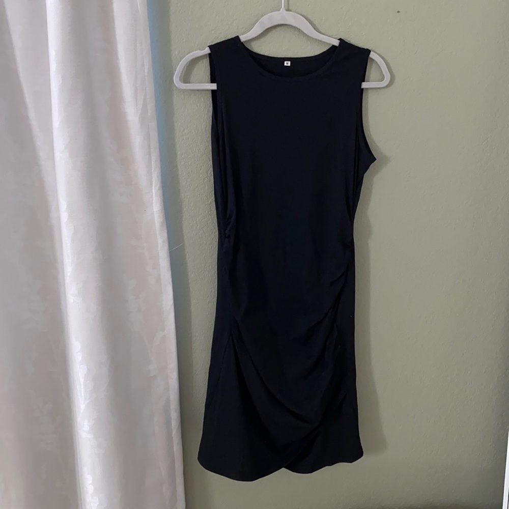 Tight side cinched black dress.